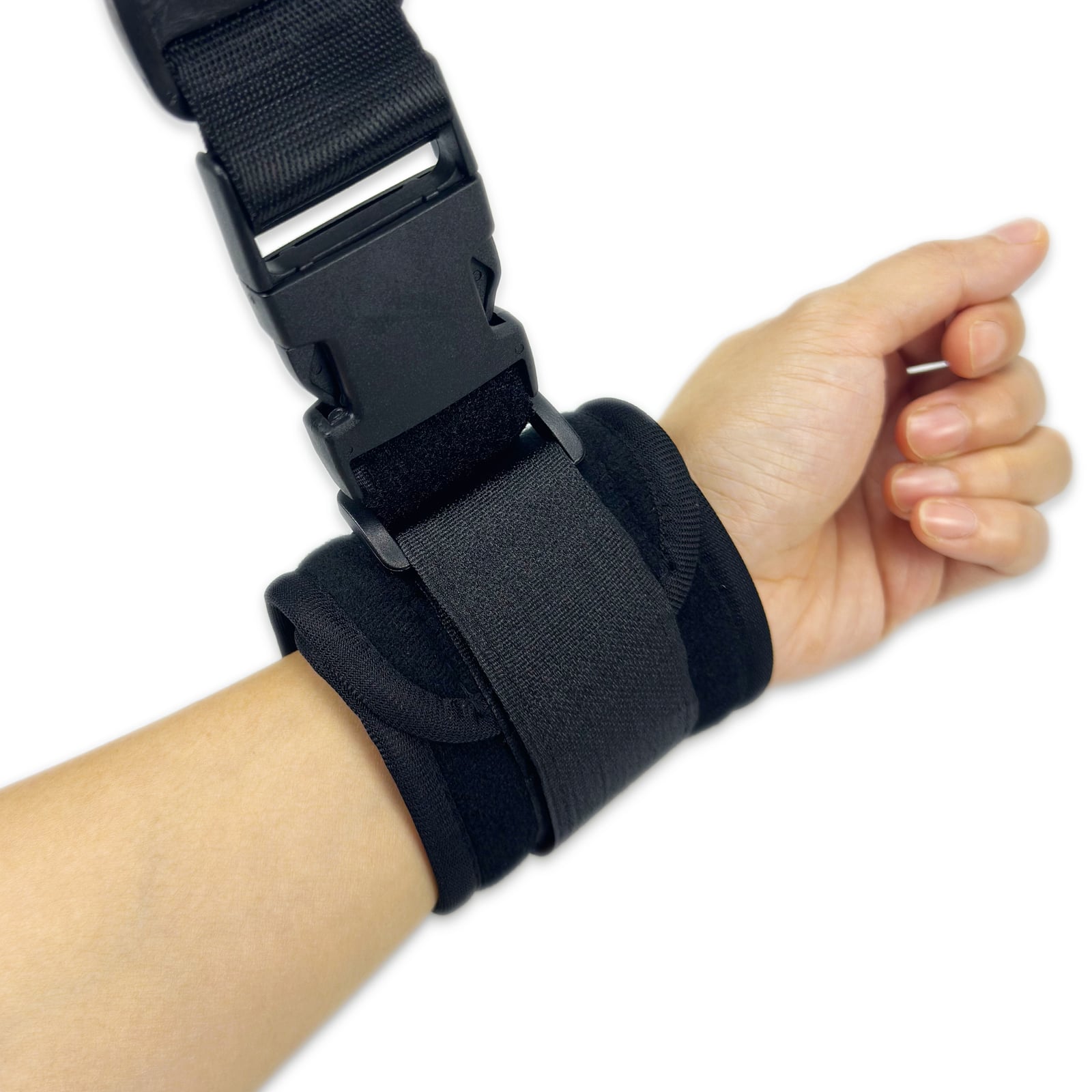 Black PSNOOK padded cuff and connected nylon strap shown on a wrist